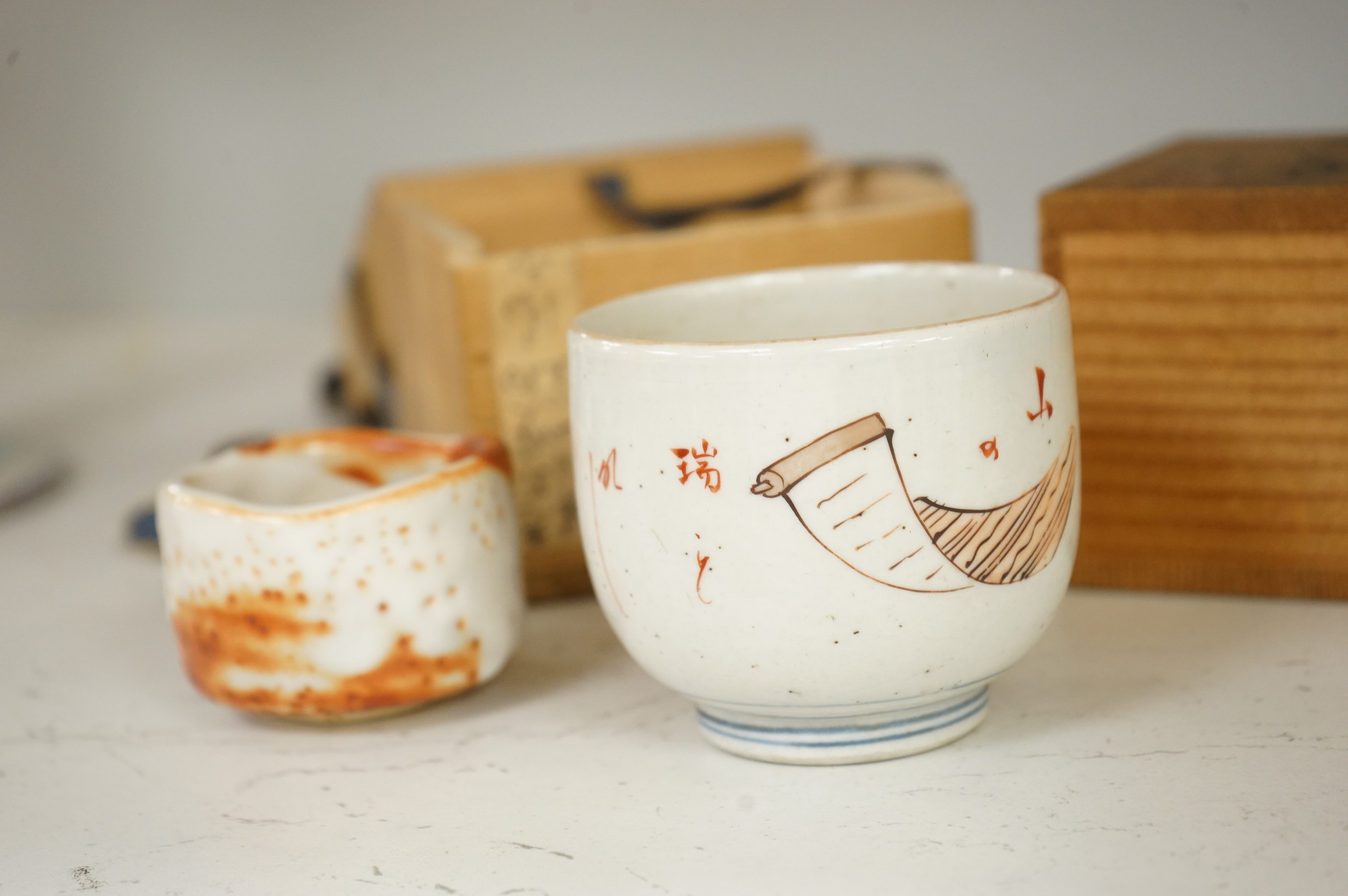 Two Japanese Mino ware sake cups, boxed, largest 7cm tall